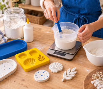 Home crafter weighing and mixing wood glue with Plaster of Paris beside silicone moulds
