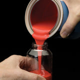 Fill a Preval reservoir with a compatible prepared coating