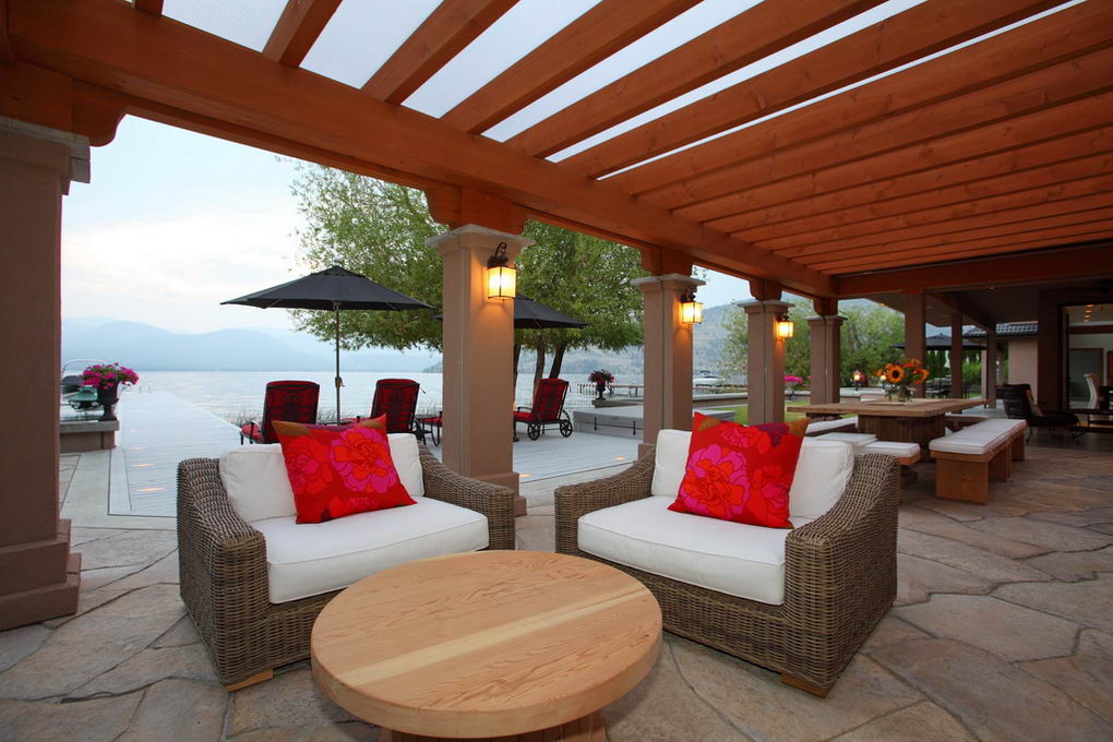 Covered outdoor seating beneath timber beams and clear polycarbonate roof panels